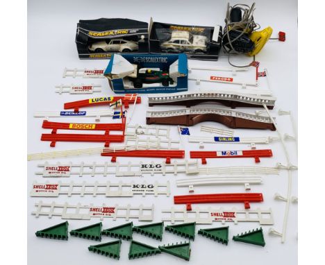 A small collection of vintage Scalextric including three boxed racing cars (boxes A/F), two controllers and selection of vari