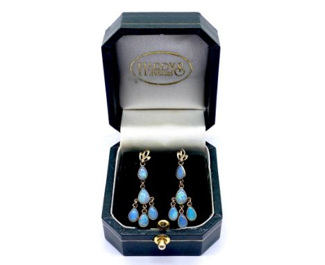 A pair of opal drop earrings set in 9ct gold 