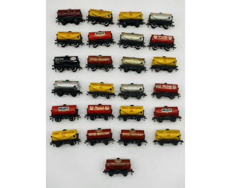 A collection of twenty five unboxed Horny Dublo OO gauge tanker wagons including Shell, Esso, LMS, Royal Daylight, Mobil, Vac