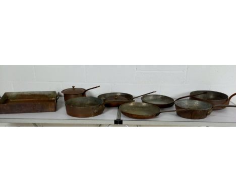 A collection of assorted vintage copper cookware.