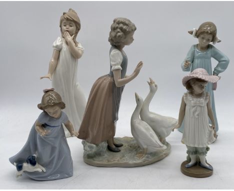 A collection of five Nao figures