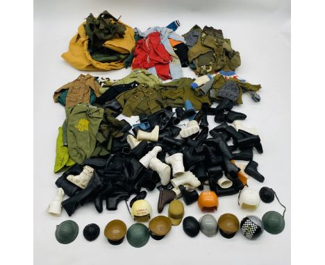 A collection of vintage Action Man accessories including army clothing, boiler suits, boots, shoes, flippers, snow boots, hel