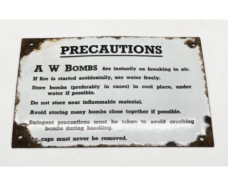  A vintage enamel warning sign “Precautions” with instructions on the storage of A W Bombs - 30.5cm x 20cm