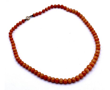 A vintage string of coral beads.