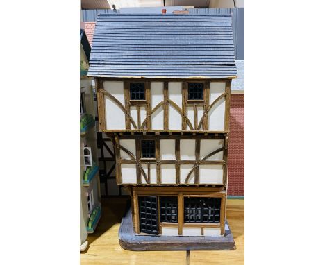 A vintage Tudor Style dolls house entitled "The House That Moved" (Exeter) by Scutchers Heritage - overall size height 89cm, 
