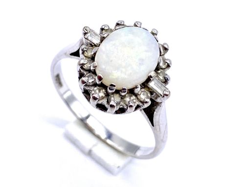 An 18ct white gold opal and diamond cluster ring, size P