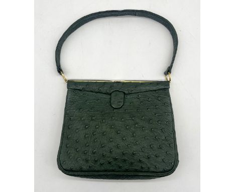 A vintage ostrich leather handbag in green with lined interior 
