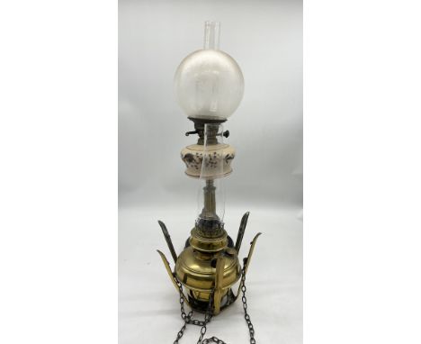 A Victorian oil lamp along with a turn of the century hanging oil lamp 