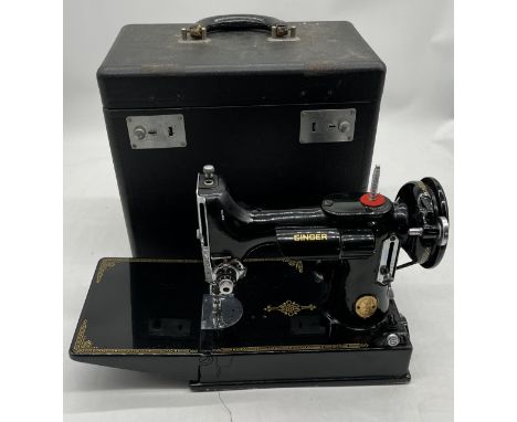 A vintage Singer Featherweight possibly (221/222) sewing machine in case (handle A/F/) in original case with foot pedal and l