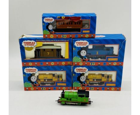 A collection of boxed Hornby OO gauge "Thomas & Friends" locomotives and coaches included "Bill" & "Ben" 0-4-0 locomotives, "