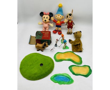 A mixed collection of toys including carpet golf, boxed Tri-ang Minic Puppy & Spider, Sooty puppet, vintage Walt Disney Pinoc