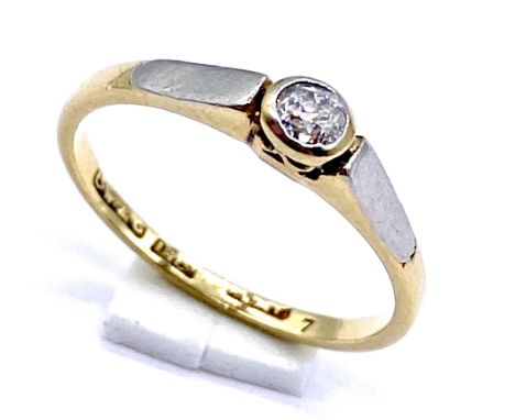 An 18ct gold and platinum solitaire diamond ring, size L, 2g total weight.