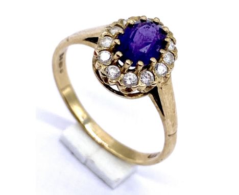 A 9ct gold cluster ring set with an amethyst, size Q