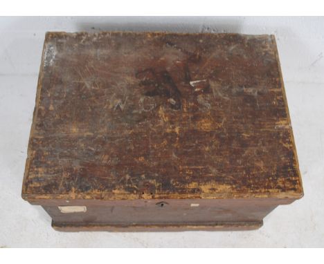 A rustic wooden trunk, with wrought iron handles - length 64cm, depth 47cm, height 38.5cm