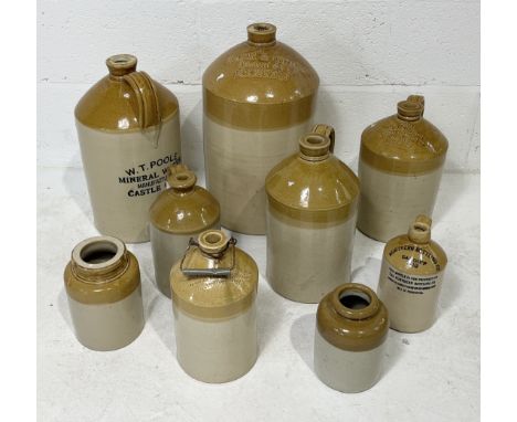 A collection of stoneware bottles and jars including Coling & Son Chard, Carr & Quick Exeter, W.T. Poole Castle Cary etc.