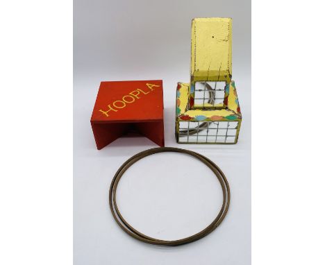 A vintage wooden hand painted fairground hoopla game on stand with two wooden hoops - possibly 1950's
