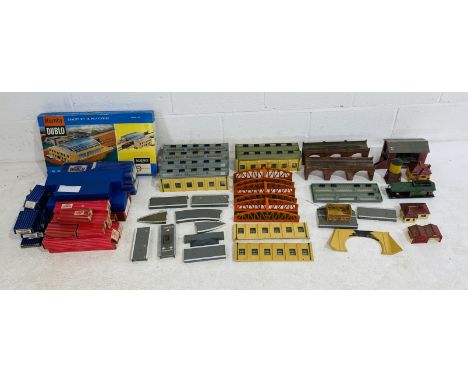 A collection of various model railway OO gauge buildings including station, viaducts. three bridges, water tower. tunnel fron