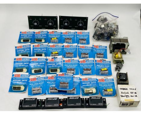 A collection of model railway electronics including carded Peco accessory switches, motors, power controller frontage, Relco 