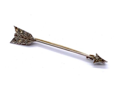 A tested 9ct gold brooch set with diamonds in the form of an arrow, approx. 5.75cm length, weight 3.4g