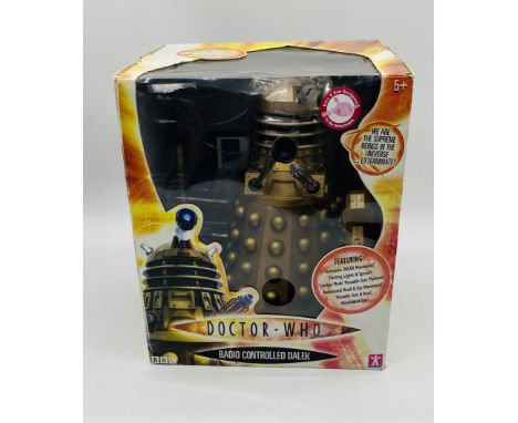 A boxed Character Options Ltd Doctor Who Radio Controlled Dalek in bronze - Item No 01629 - Dalek height 12"