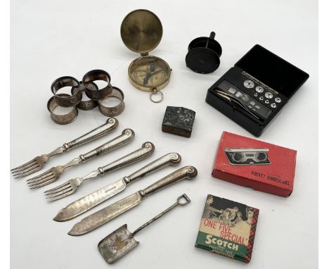 An assortment of various items including Griffin & Tatlock cased weights, compass, silver plated cutlery and napkin rings etc