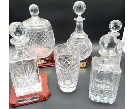 A collection of assorted crystal items commemorating horse racing wins.