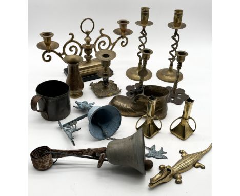 A collection of assorted brassware including Eastern candlesticks, servants bell, crocodile nutcracker etc.