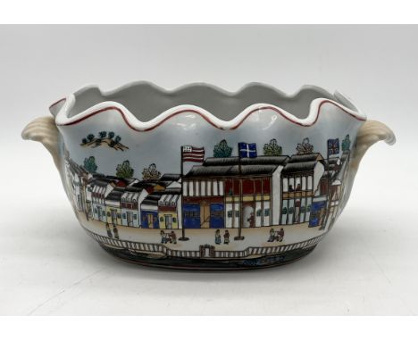 A Chinese porcelain planter with scalloped edge decorated with scenes from The Hongs at Canton - length 37cm