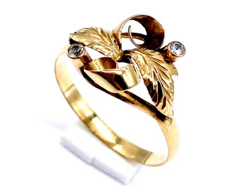 An 18ct gold (tested) floral ring set with two small diamonds, size N 1/2, total weight 1.6g
