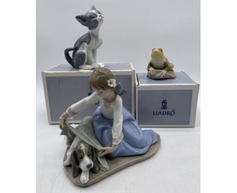 A boxed Lladro figure of a frog along with a kitten and a Lladro figure group of a girl and dog