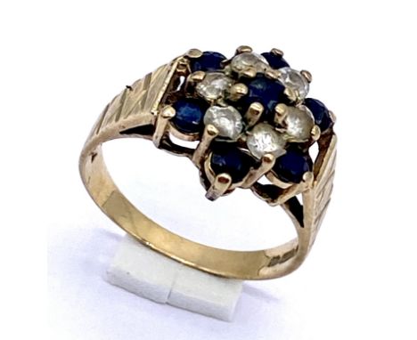 A 9ct gold cluster ring set with sapphires, size L 1/2, total weight 3.1g