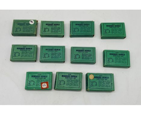 A collection of eleven boxed Hornby Dublo model railway OO gauge green switches (G3)