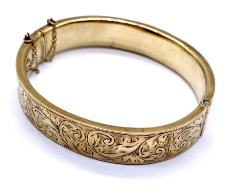 A 9ct gold hinged bangle, weight 18.9g