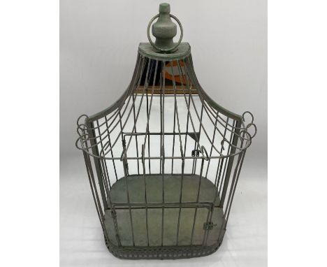 A vintage mirror backed hanging display unit in the form of a bird cage