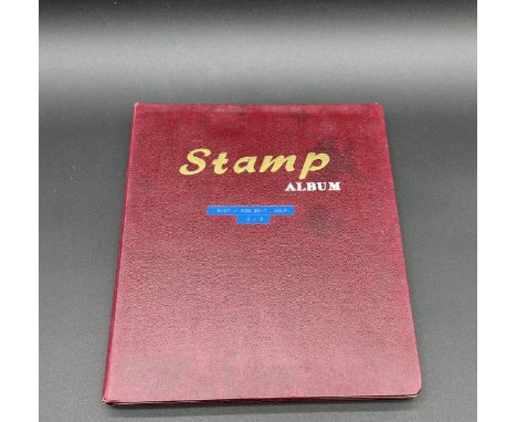 An album of vintage worldwide stamps including Niue, North Borneo, Papua & New Guinea, Pitcairn Islands, Sarawak, Rhodesia, S
