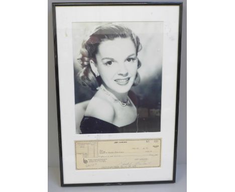 A Judy Garland signed cheque and photograph display with Rutland Autographs AFTAL registered C.O.A. 