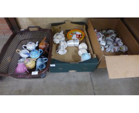 Three boxes of mixed decorative china including small teapots, retro tea wares, Clarice Cliff style plates, preserve pots, et