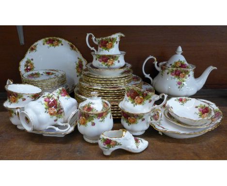 A Royal Albert Old Country Roses six setting tea and dinner service with dinner, side and tea plates, bowls, sugar, milk, ser