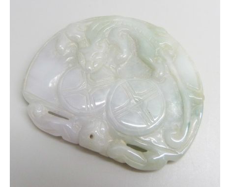 A carved jade pendant, 5.6cm x 4.6cm, 41g 