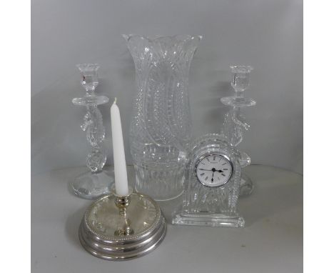 Waterford Crystal; tall candle hurricane light and stand, a pair of seahorse candlesticks, all boxed and a crystal mantel clo