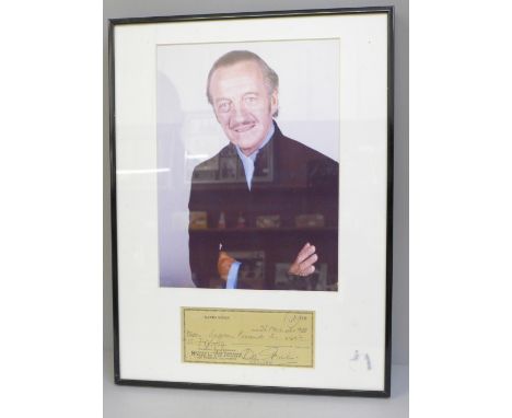 A David Niven signed cheque and photograph display with Rutland Autographs AFTAL registered C.O.A. 