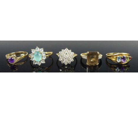 Five various 9ct gold semi-precious set dress rings, comprising a cz flower head cluster example, size L; a round cut amethys
