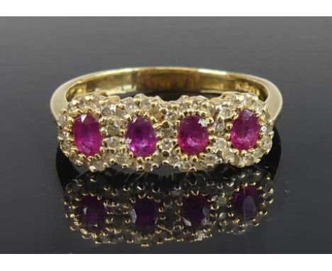 An 18ct yellow gold, ruby and diamond multi-cluster ring, featuring four oval rubies within a border of 44 single cut diamond