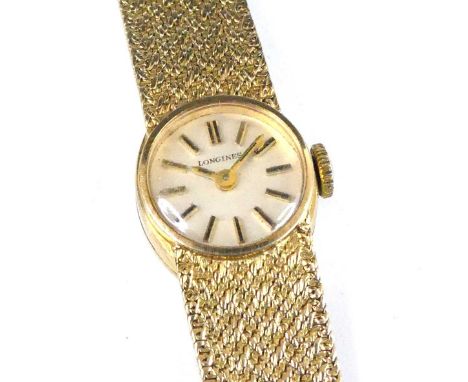 A lady's Longines 9ct gold cased bracelet watch, having a signed champagne dial with baton markers, manual wind movement, cas