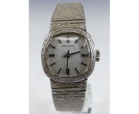 A lady's Longines 9ct white gold bracelet watch, having a signed silvered dial with baton markers, manual wind movement, case