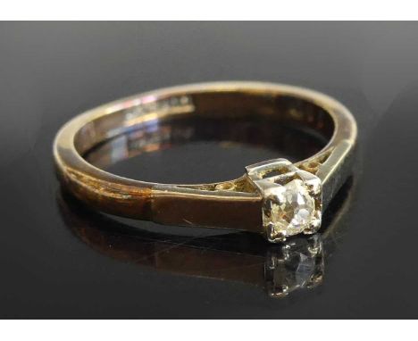 A yellow and white metal diamond solitaire ring, comprising an old cushion cut diamond in a four-claw setting, diamond dimens