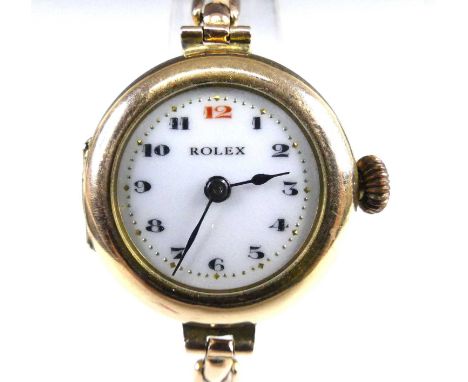 A vintage lady's Rolex 9ct gold cased wristwatch, having signed white enamel Arabic dial with gilded dot minute markers, unsi
