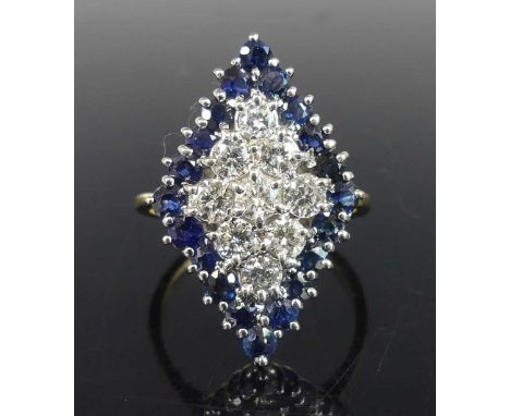 An 18ct yellow and white gold, sapphire and diamond navette cluster ring, comprising a centre section of nine round brilliant