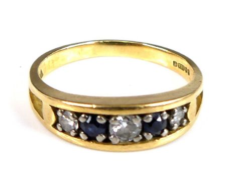 An 18ct yellow gold, sapphire and diamond half eternity ring, featuring two round sapphires alternating with three graduated 