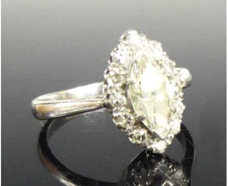 An 18ct white gold and platinum diamond cluster ring, arranged as a four-claw set marquise cut diamond measuring approx 9.2 x